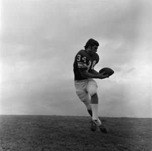 [Football player holding the ball, 8]