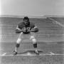 Photograph: [Football player number 67 in a football field, 2]