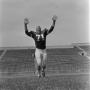 Photograph: [Football player number 71 jumping, 4]