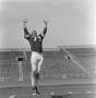 Photograph: [Football player number 71 jumping]