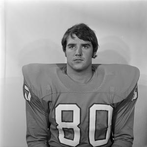 [Football player sitting for a portrait, 80]