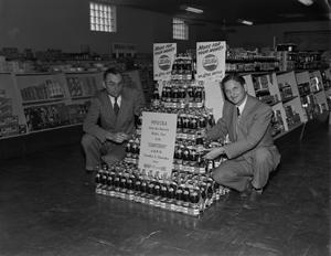 [Two men with a Pepsi-Cola display]