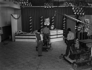 [Sound stage for a Christmas program with camera operators]