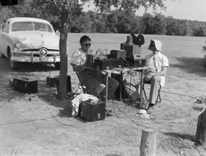[Two men with film or radio equipment]