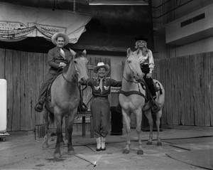 [Bobby Peters and two horses with guests]