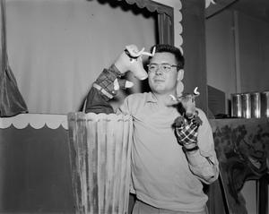 [Dean Raymond with two longhorn puppets]