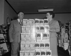 [Man and woman with a Betty Crocker product display]