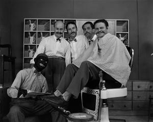 [Four men and one man in blackface on barbershop set]