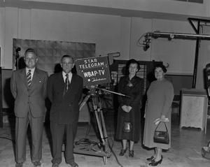 [Four people and TV camera in studio]