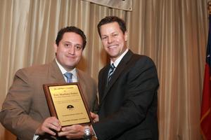 [Fred K. Hartman presenting award to Trey Martinez Fisher]