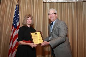 [Sharon Grigsby receiving award at TDNA conference]