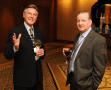 Photograph: [Photograph of two men attending the 2010 TDNA conference]