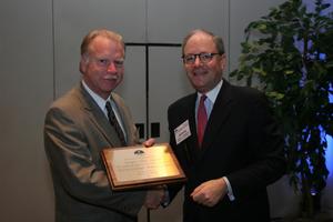 [Jeremy L. Halbreich handing out award to Donnis Baggett]