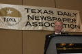 Primary view of [Donnis Baggett speaking into mic at TDNA conference]