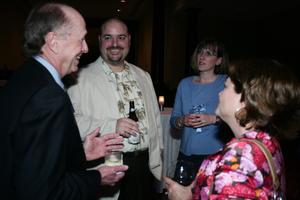 [John and Donna Roberts talking with guests at reception]