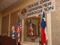 Thumbnail image of item number 1 in: '[Gary Borders standing at podium giving speech at TDNA meeting]'.