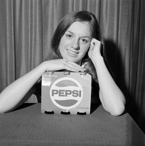 [Woman posing with Pepsi]