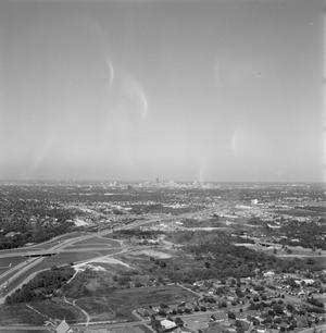 [Distant view of downtown Dallas]