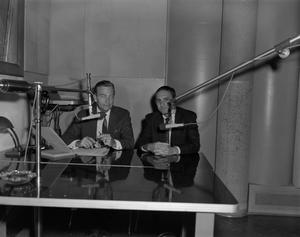 Primary view of object titled '[Frank and unknown man broadcasting]'.
