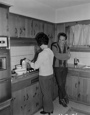 [Bill Mack and his wife Cynthia in the kitchen]