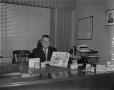 Photograph: [Man posing with various Bristol-Myers products]