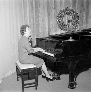 [Woman playing the piano]