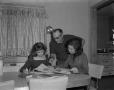 Photograph: [Gene O'Bannon with wife and daughter]