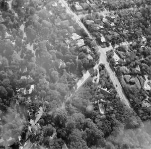 [Aerial view of a neighborhood]