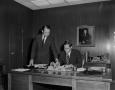 Photograph: [Two men in an office]