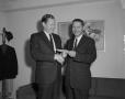 Photograph: [Two men shaking hands]