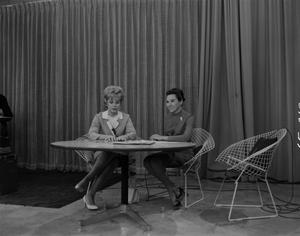 [Bobbie seated with female guest]
