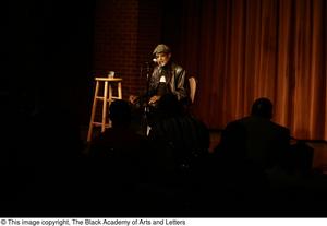 [Photograph of director Melvin Van Peebles speaking to an audience]