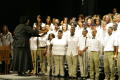 Primary view of [Choir looks toward the conductor on stage]