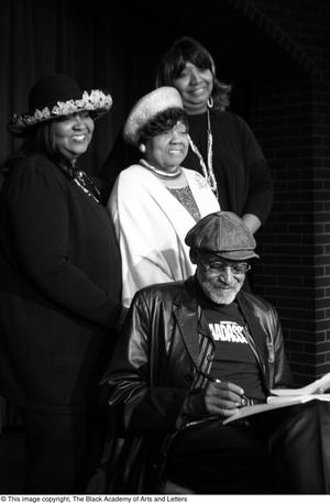 [Photograph of Babara Steele, an unidentified woman, and Isabell Cottrell standing behind Melvin Van Peebles]