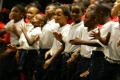 Primary view of [Children moving their hands on stage]