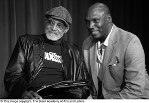 [Photograph of an unidentified man posing with Melvin Van Peebles]
