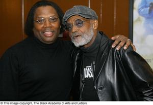 [Photograph of Curtis King and Melvin Van Peebles posing together]