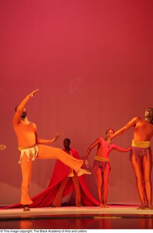 [Photograph of dancers in orange leotards]
