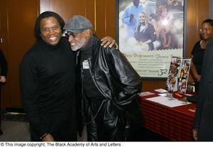 [Photograph of Curtis King standing with Melvin Van Peebles]