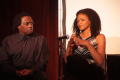 Photograph: [Curtis King sits on stage with Kimberly Elise]