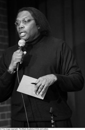 [Photograph of Curtis King talking into a microphone at 24-Hour Film Feast]
