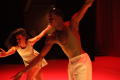 Thumbnail image of item number 1 in: '[Photograph of a woman and man dancing together on a stage]'.