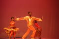 Thumbnail image of item number 1 in: '[Photograph of three dancers on stage dressed in orange outfits]'.