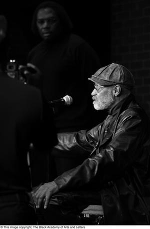 [Photograph of Melvin Van Peebles talking to an audience at 24-Hour Film Feast]