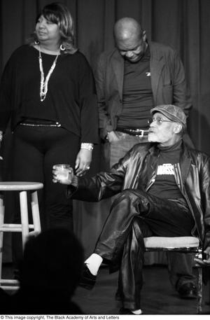 [Photograph of Melvin Van Peebles and two unidentified individuals on stage]
