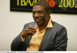 Primary view of object titled '[Vondie Curtis Hall smiles while holding cup]'.