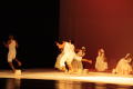 Thumbnail image of item number 1 in: '[Photograph of a group of men and women performing a dance on stage]'.