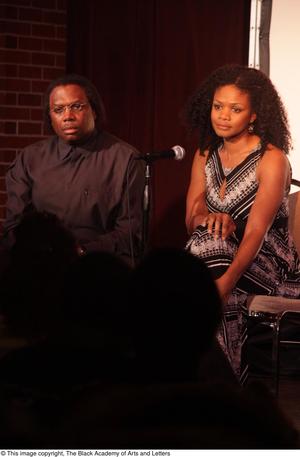 [Kimberly Elise and Curtis King look straight into the audience]