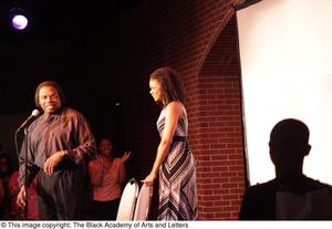 Primary view of object titled '[Kimberly Elise looks toward Curtis King]'.
