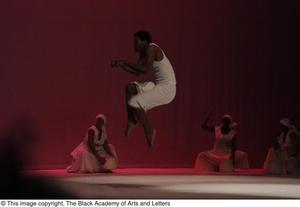 [Photograph of a dancer leaping into the air on stage, 3]